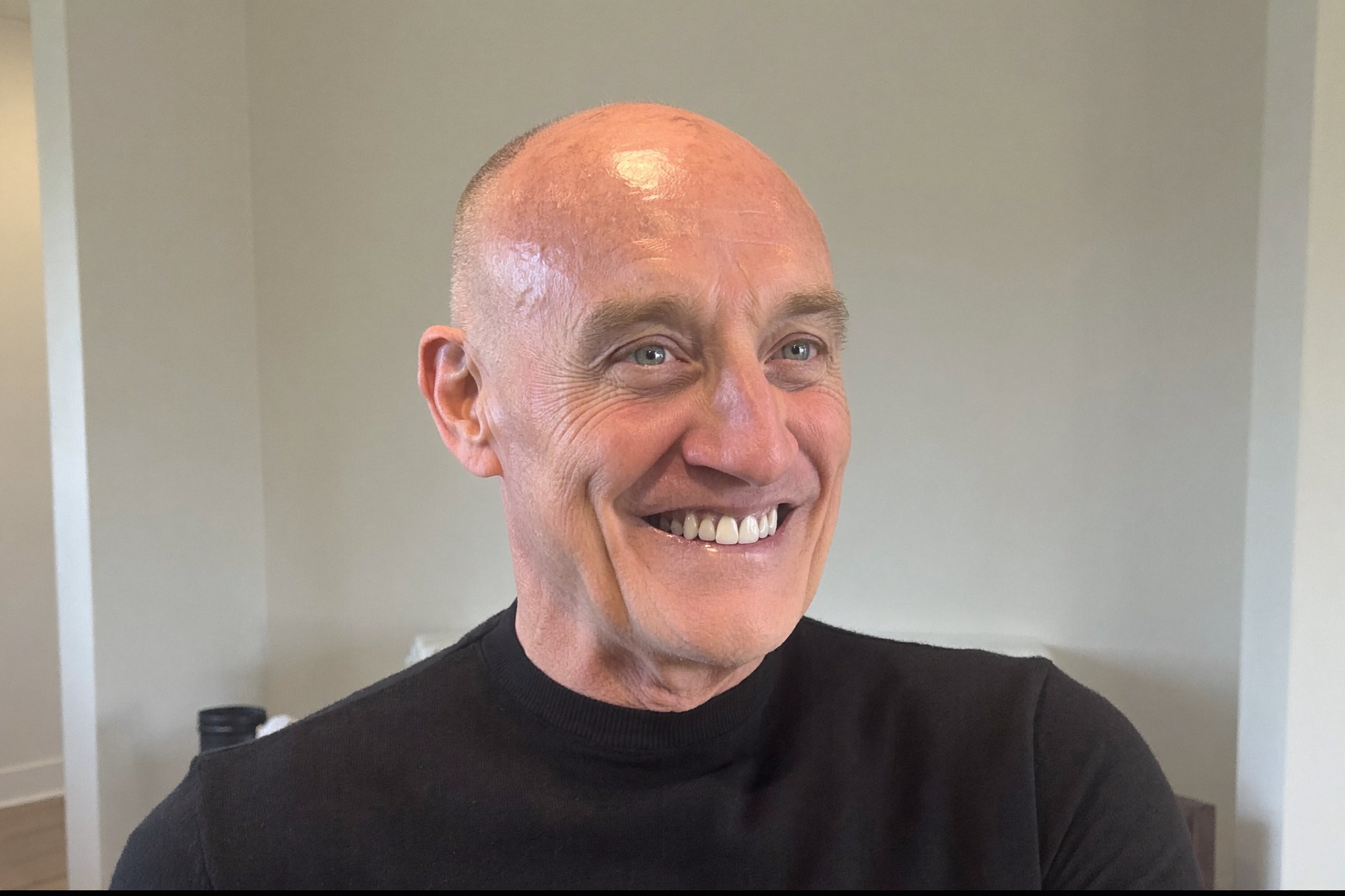 Dr. Timothy Adams mid-laugh in conversation